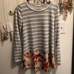 Striped shirt with floral detail.
